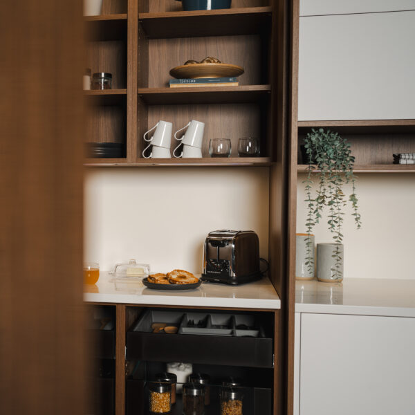 Brown and white kitchen, shelves with food