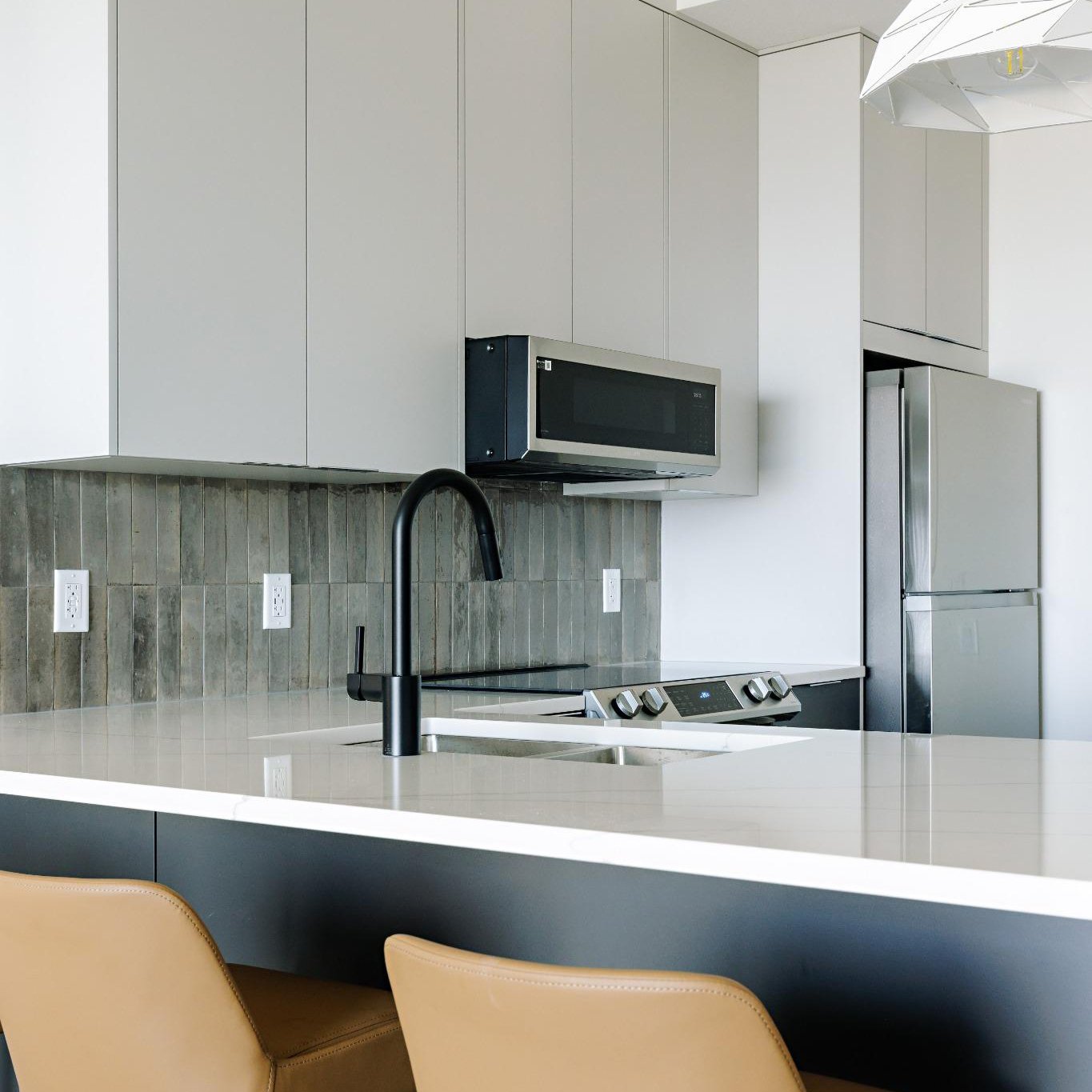 Light Sunset grey material colour kitchen with dark elements